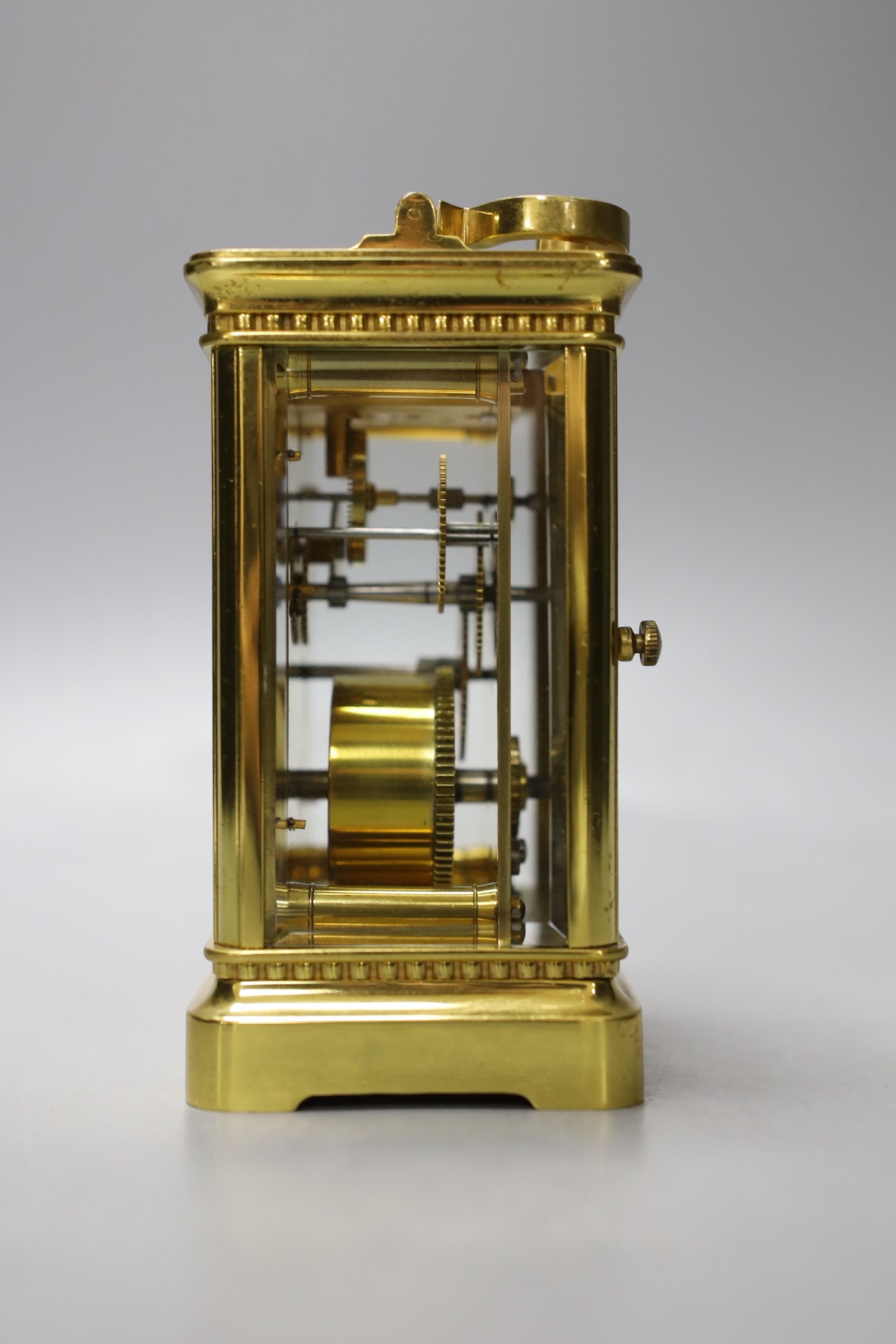 A cased French gilt brass carriage timepiece with relief cast dial and engraved presentation inscription - 14cm tall